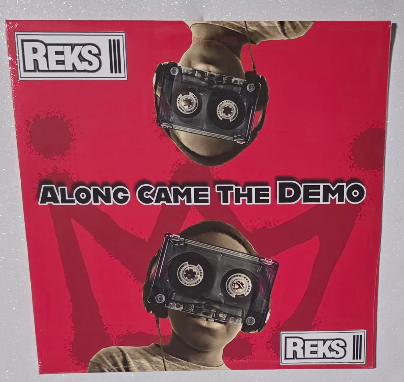 REKS - Along Came The Demo (2025) (Limited Edition Clear with Red Swirl & Black Splatter Colour Vinyl LP)